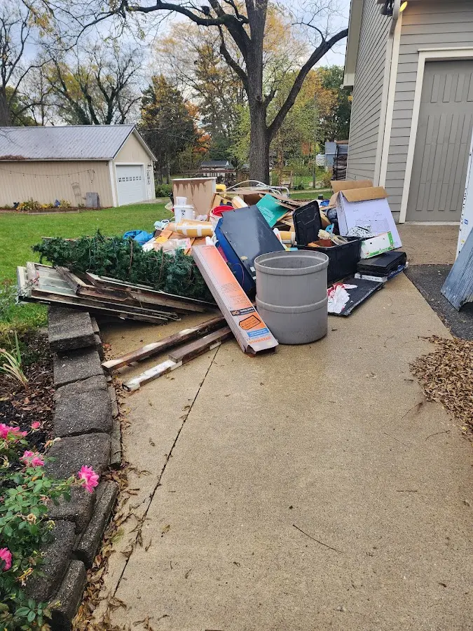 Dumpster being loaded with debris for Commercial Dumpster Rental in Nebraska City